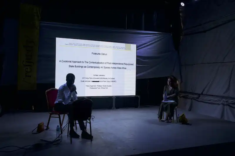 Lagos Biennial founder and Director Folakunle Oshun presenting his doctoral thesis along with project supervisor Prof. Cecile Duostaly, Lagos Biennial 2024, photo credit_ Lagos Biennial